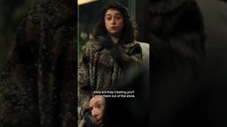 Him, with the glasses.